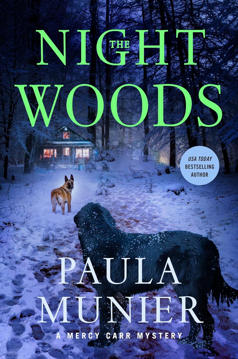 Book cover for "The Night Woods" by Paula Munier. A snowy nighttime forest scene with bare trees silhouetted against a dark blue sky. In the foreground, a snow-covered path leads to a distant log cabin with warm, glowing windows. Two dogs stand on the path - a German Shepherd in the middle distance and a large, shaggy black dog closer to the viewer. The book title "The Night Woods" is displayed in large, bright green text at the top of the cover. The author's name "Paula Munier" appears in white text at the bottom. A blue circular badge in the lower right corner indicates "USA Today Bestselling Author". The cover suggests a winter mystery or thriller set in a remote, wooded location